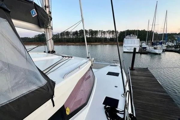 Slide: The Image of 2023 Fountaine Pajot Isla 40 catamaran docked at serene marina. - 71