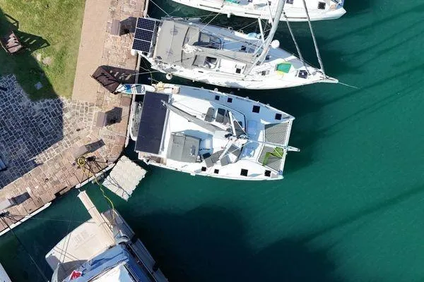 Slide: The Image of Aerial view of 2023 Fountaine Pajot Isla 40 catamaran docked in a marina. - 74
