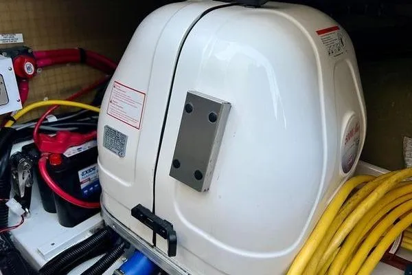 Slide: The Image of Engine compartment of 2023 Fountaine Pajot Isla 40 with cables and battery. - 90