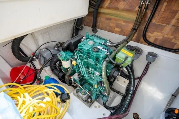 Slide: The Image of Engine compartment of 2023 Fountaine Pajot Isla 40 catamaran with visible wiring and components. - 91