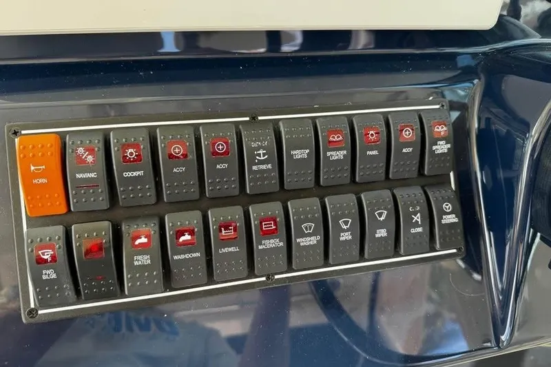 Slide: The Image of 2014 Pursuit OS 345 Offshore boat docked, featuring Yamaha outboard motor, under cloudy skies. - 16