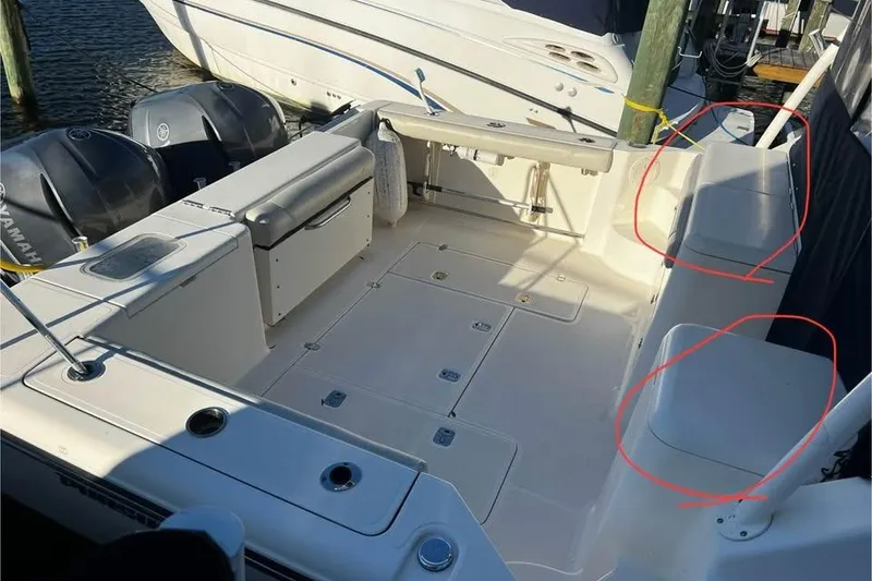 Slide: The Image of 2014 Pursuit OS 345 Offshore boat interior with seating and Yamaha engines. - 25
