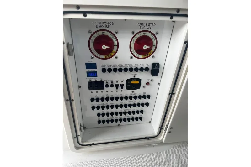 Slide: The Image of Electrical control panel on a 2014 Pursuit OS 345 Offshore boat. - 30