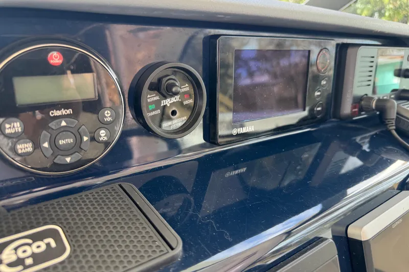 Slide: The Image of Dashboard of 2014 Pursuit OS 345 Offshore boat with Clarion and Yamaha controls. - 48