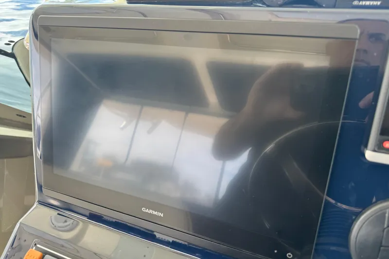 Slide: The Image of Garmin display on 2014 Pursuit OS 345 Offshore boat dashboard. - 49