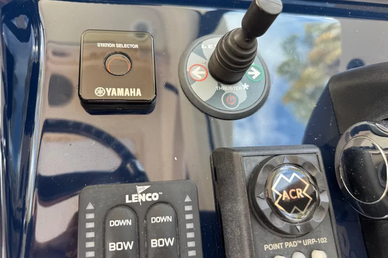 Slide: The Image of Control panel of a 2014 Pursuit OS 345 Offshore boat with Yamaha and Lenco controls. - 50