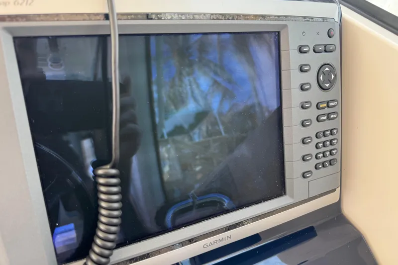 Slide: The Image of Garmin marine GPS system on 2014 Pursuit OS 345 Offshore boat dashboard. - 52