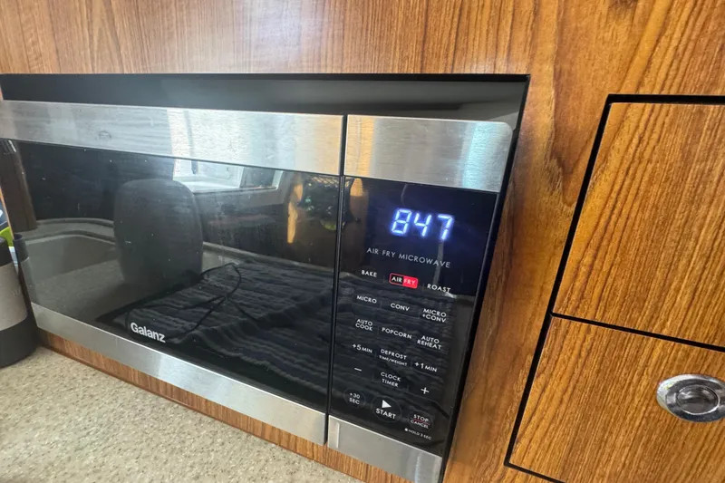 Slide: The Image of Galanz air fry microwave in 2014 Pursuit OS 345 Offshore boat kitchen. - 60