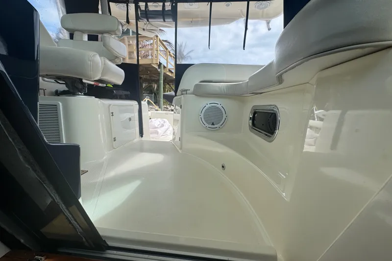 Slide: The Image of Interior view of 2014 Pursuit OS 345 Offshore boat, featuring seating and speakers. - 70