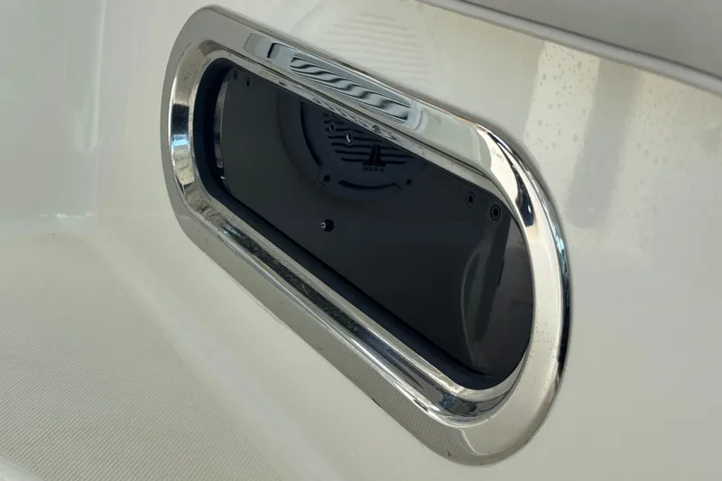 Slide: The Image of 2014 Pursuit OS 345 Offshore boat speaker with chrome trim detail. - 71