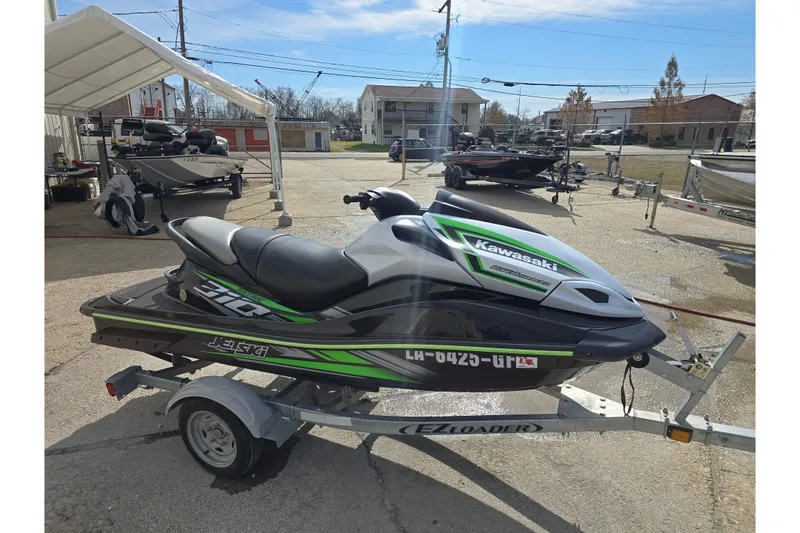 Slide: The Image of 2016 Kawasaki Jetski Ultra 310X on trailer, parked outdoors. - 0
