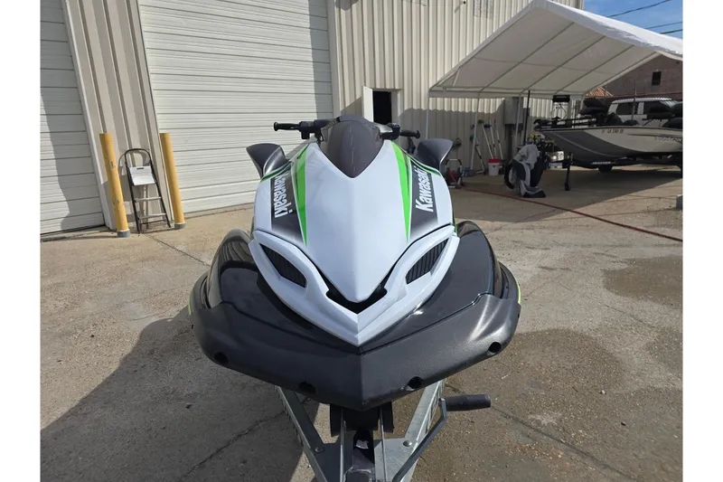 Slide: The Image of 2016 Kawasaki Jetski Ultra 310X parked outside a garage, front view. - 3