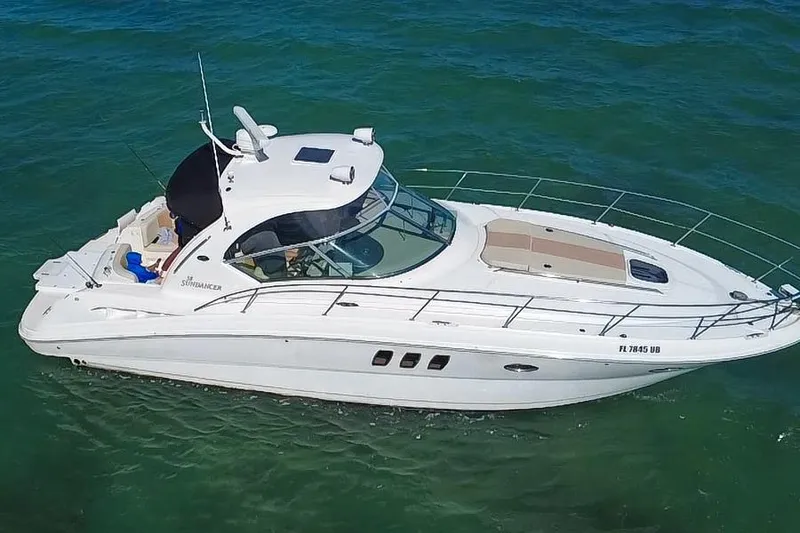 Slide: The Image of 2008 Sea Ray 380 Sundancer yacht cruising on clear blue water. - 2