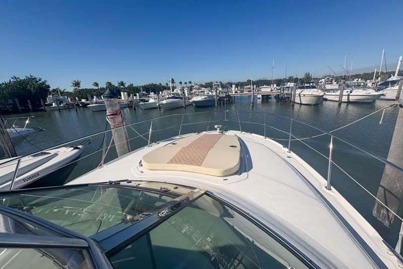 Slide: The Image of 2008 Sea Ray 380 Sundancer docked in a marina under clear blue skies. - 20