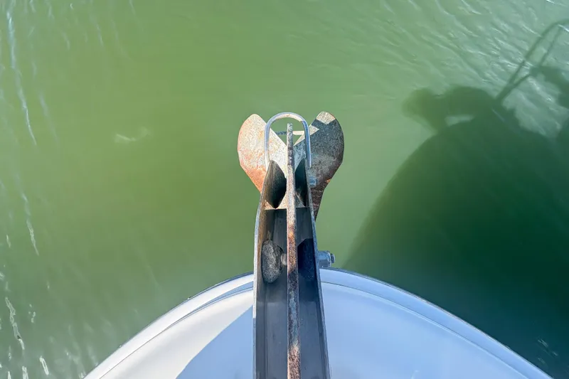 Slide: The Image of Bow view of 2008 Sea Ray 380 Sundancer with anchor over green water. - 23