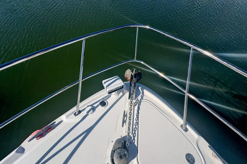 Slide: The Image of Bow of 2008 Sea Ray 380 Sundancer yacht on calm water. - 24