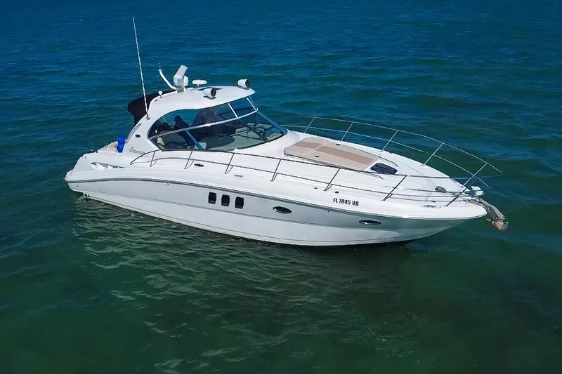 Slide: The Image of 2008 Sea Ray 380 Sundancer yacht cruising on clear blue water. - 3