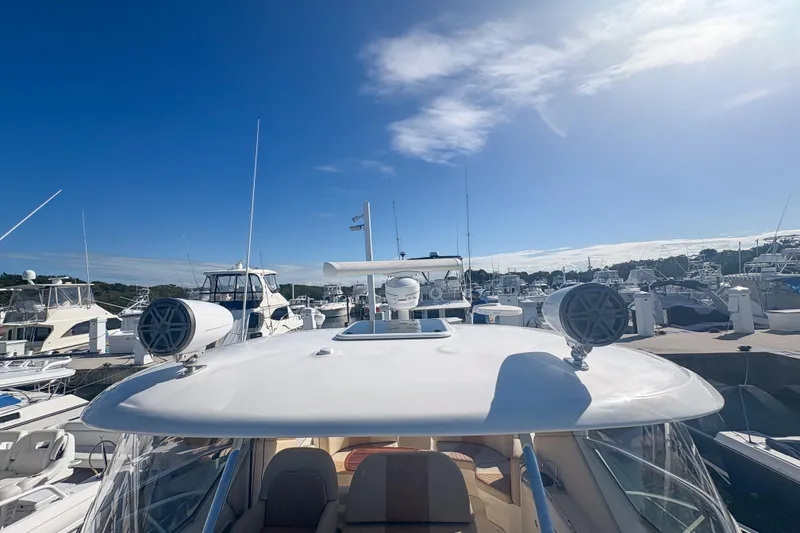 Slide: The Image of 2008 Sea Ray 380 Sundancer yacht docked at marina under clear blue sky. - 37