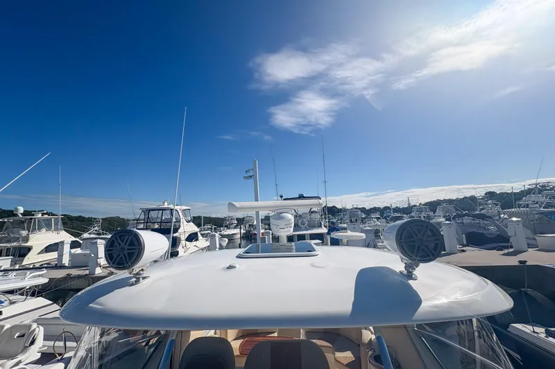 Slide: The Image of 2008 Sea Ray 380 Sundancer yacht docked under clear blue sky. - 38