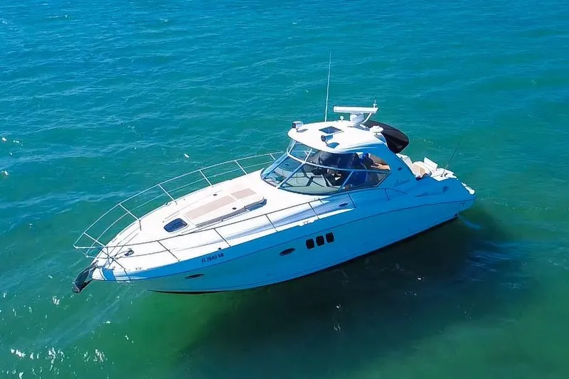 Slide: The Image of 2008 Sea Ray 380 Sundancer yacht cruising on clear blue waters. - 4