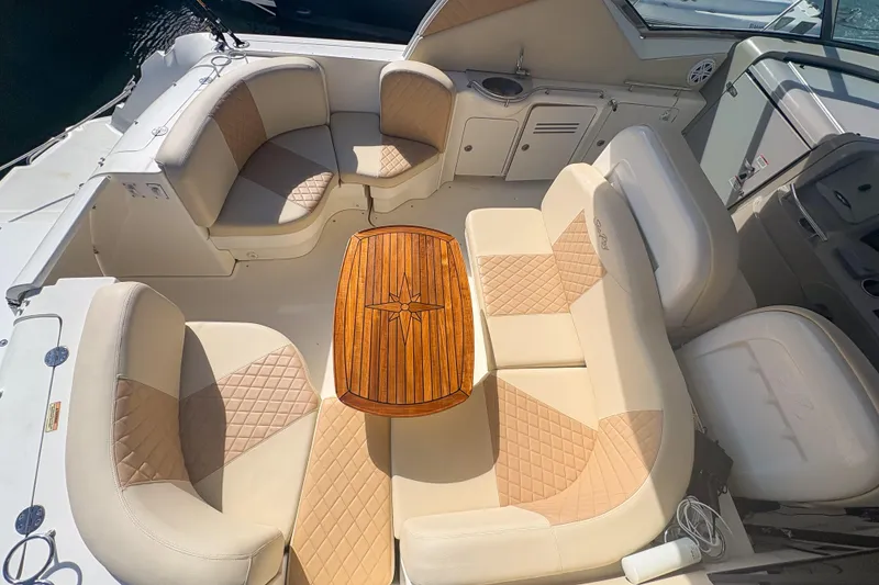 Slide: The Image of Luxurious seating area on a 2008 Sea Ray 380 Sundancer yacht with elegant wood table. - 41