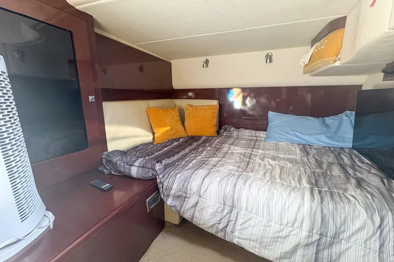 Slide: The Image of Interior cabin of 2008 Sea Ray 380 Sundancer with cozy bed and modern decor. - 44