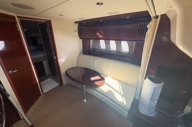 Slide: The Image of Interior of 2008 Sea Ray 380 Sundancer with seating area and table. - 49