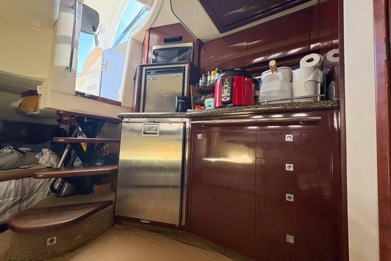 Slide: The Image of Interior of 2008 Sea Ray 380 Sundancer yacht kitchen with appliances and storage. - 53