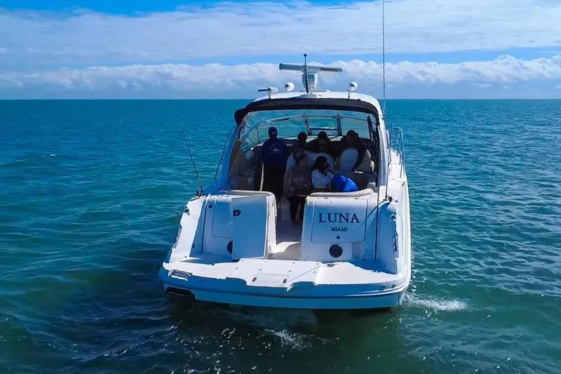 Slide: The Image of 2008 Sea Ray 380 Sundancer yacht "Luna" cruising on open water, Miami. - 6