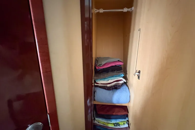Slide: The Image of Closet with folded clothes inside a 2008 Sea Ray 380 Sundancer yacht. - 61