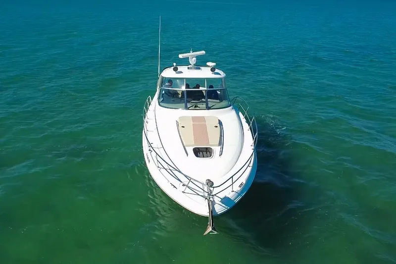 Slide: The Image of 2008 Sea Ray 380 Sundancer cruising on clear blue water. - 79