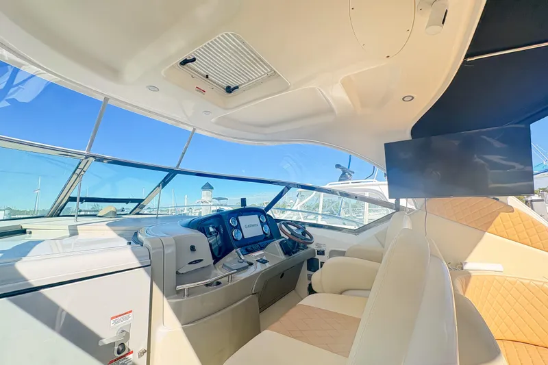 Slide: The Image of Interior of 2008 Sea Ray 380 Sundancer yacht with modern helm and seating. - 8