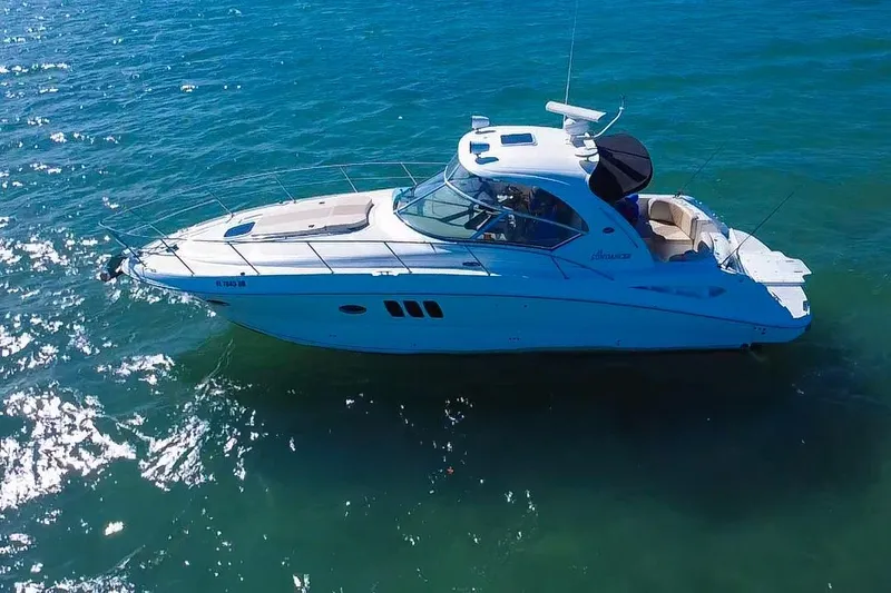 Slide: The Image of 2008 Sea Ray 380 Sundancer yacht cruising on clear blue water. - 81