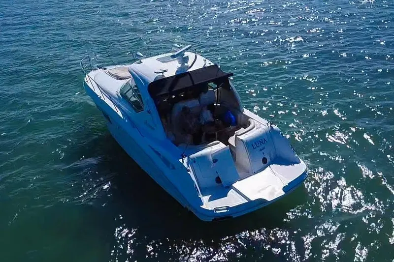 Slide: The Image of 2008 Sea Ray 380 Sundancer yacht cruising on sparkling blue water. - 82