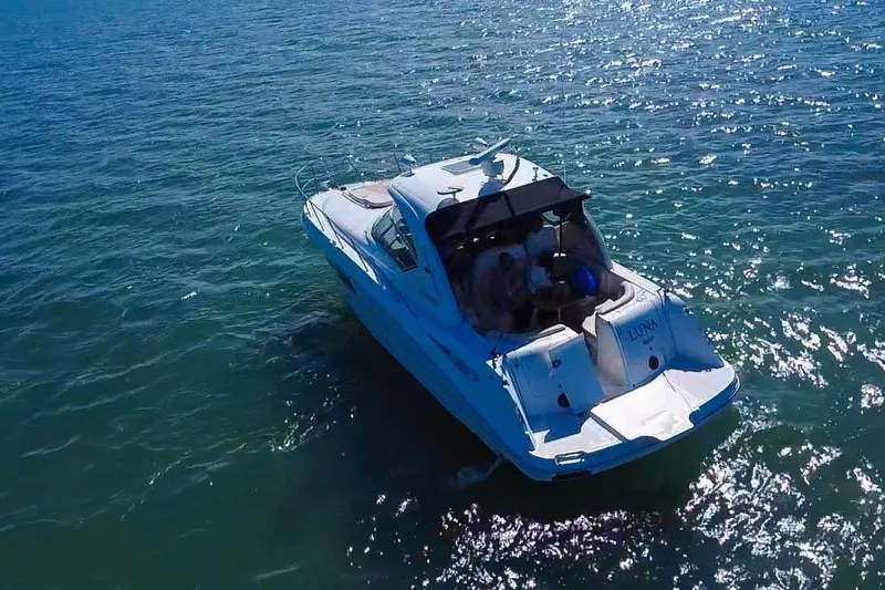 Slide: The Image of 2008 Sea Ray 380 Sundancer cruising on sparkling blue water. - 83