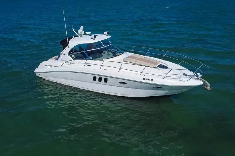 Slide: The Image of 2008 Sea Ray 380 Sundancer yacht cruising on open water. - 84