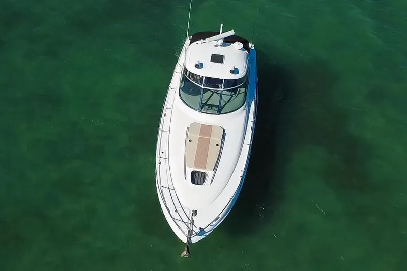 Slide: The Image of Aerial view of 2008 Sea Ray 380 Sundancer yacht on clear green water. - 88