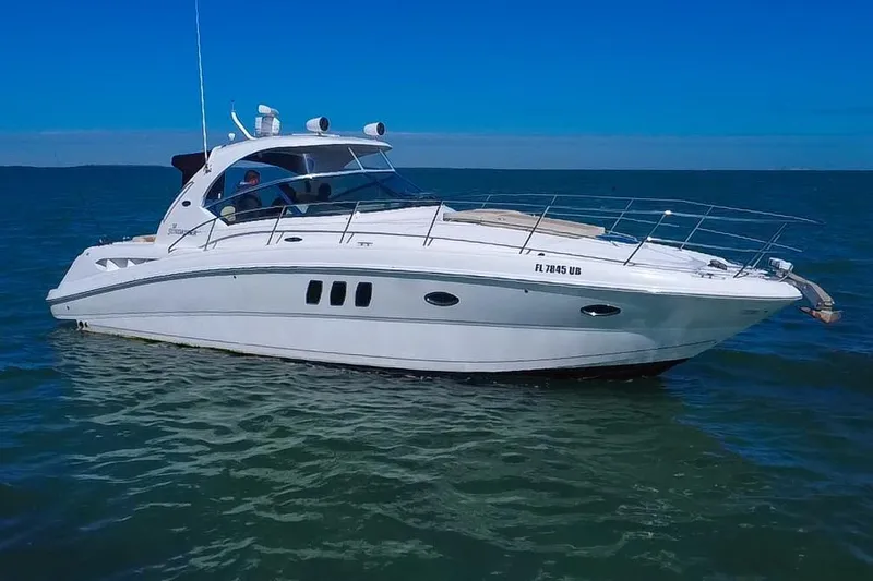 Slide: The Image of 2008 Sea Ray 380 Sundancer yacht cruising on open water. - 89