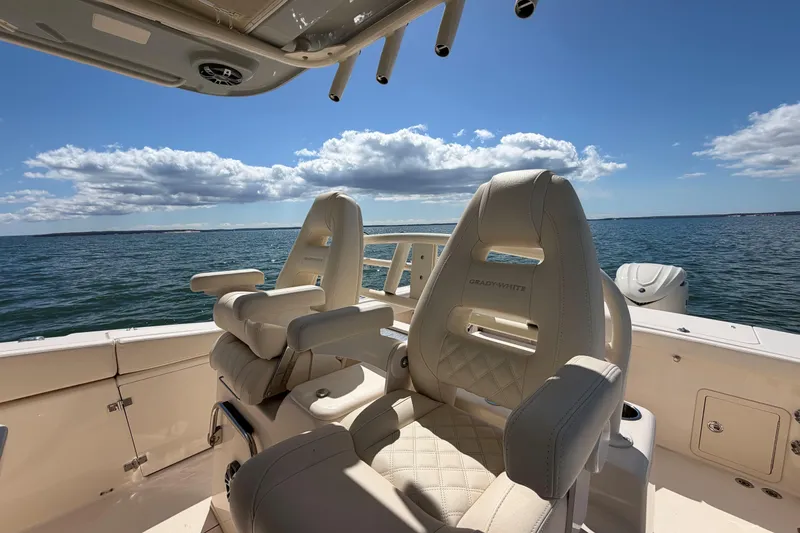 Slide: The Image of Luxury seating on 2026 Grady-White Canyon 306 boat, ocean view, sunny day. - 18