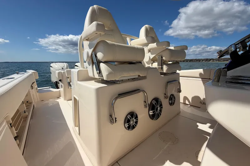 Slide: The Image of 2026 Grady-White Canyon 306 boat interior with luxurious seating and ocean view. - 21