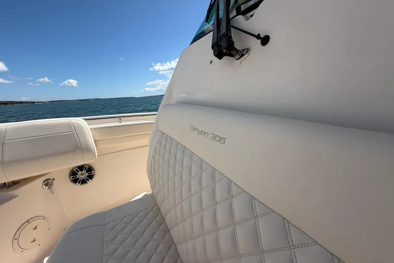 Slide: The Image of 2026 Grady-White Canyon 306 boat interior with quilted seating, ocean view. - 28