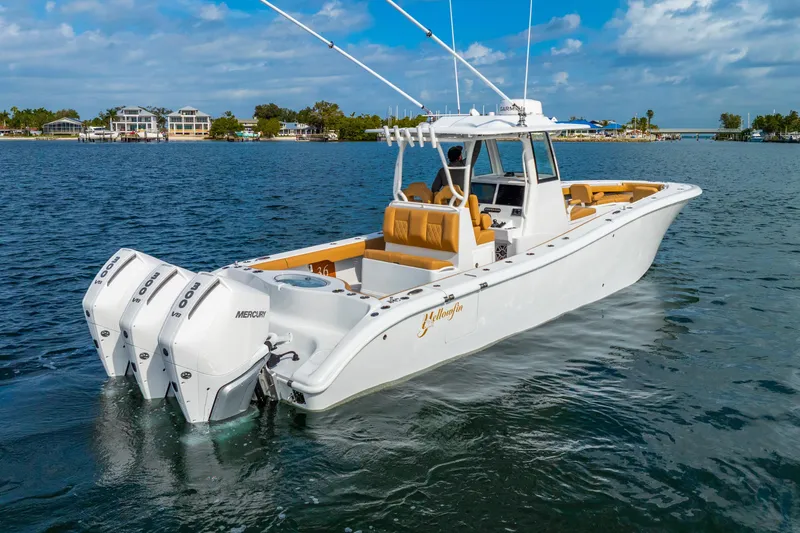 Slide: The Image of 2026 Yellowfin 36 Offshore boat on calm water. - 2