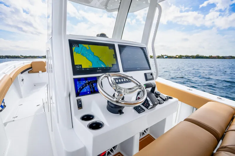 Slide: The Image of 2026 Yellowfin 36 Offshore boat helm console on the water. - 9