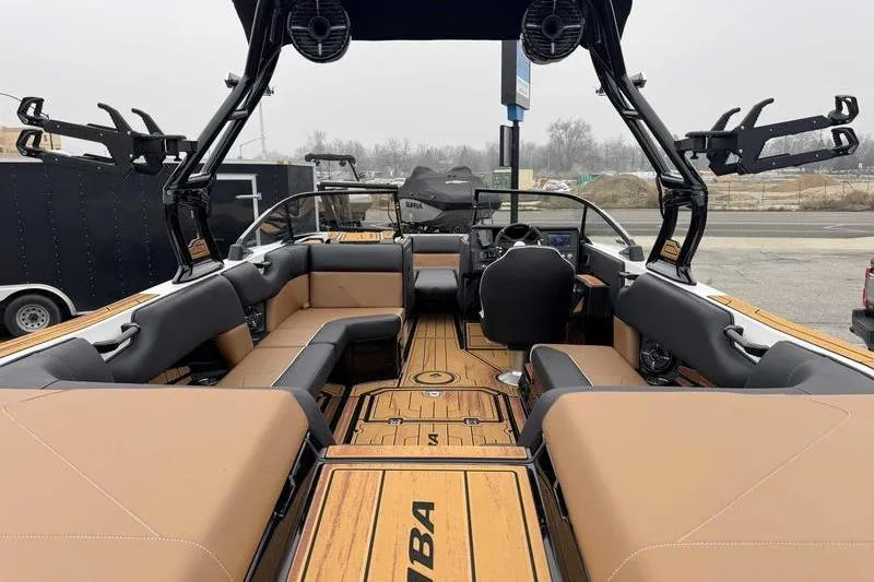 Slide: The Image of 2026 Moomba Tykon boat interior with tan seating and modern design. - 3