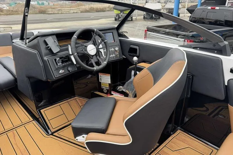 Slide: The Image of Interior of 2026 Moomba Tykon boat with modern steering and dashboard controls. - 9