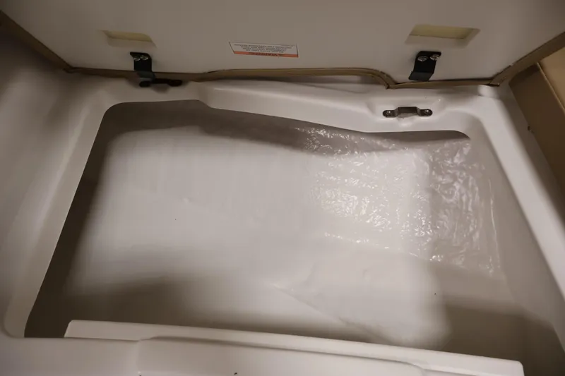 Slide: The Image of 2026 Bayliner V20i storage compartment, open and empty, showcasing interior space. - 13