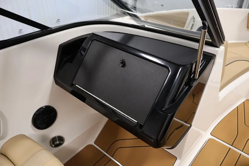 Slide: The Image of 2026 Bayliner V20i boat interior with sleek dashboard and modern design. - 26