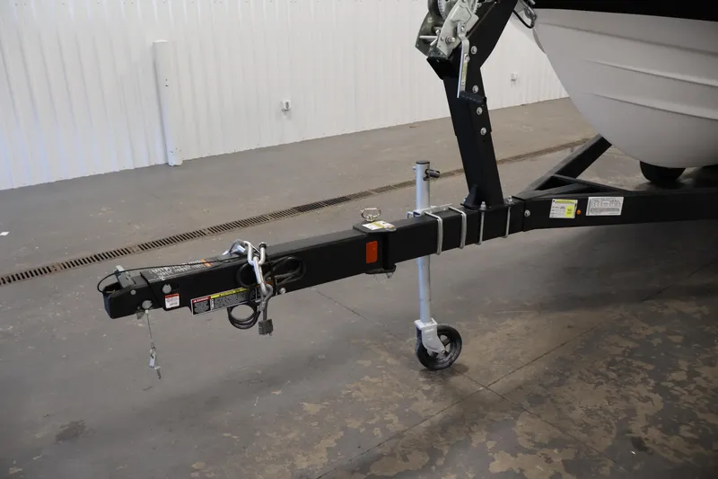 Slide: The Image of Trailer hitch of a 2026 Bayliner V20i boat in a garage setting. - 35