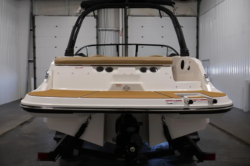 Slide: The Image of 2026 Bayliner V20i boat rear view in a garage setting. - 5