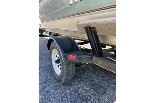 Slide: The Image of 2002 Tracker Pro Angler V 16 boat trailer, close-up view of wheel and hull. - 8